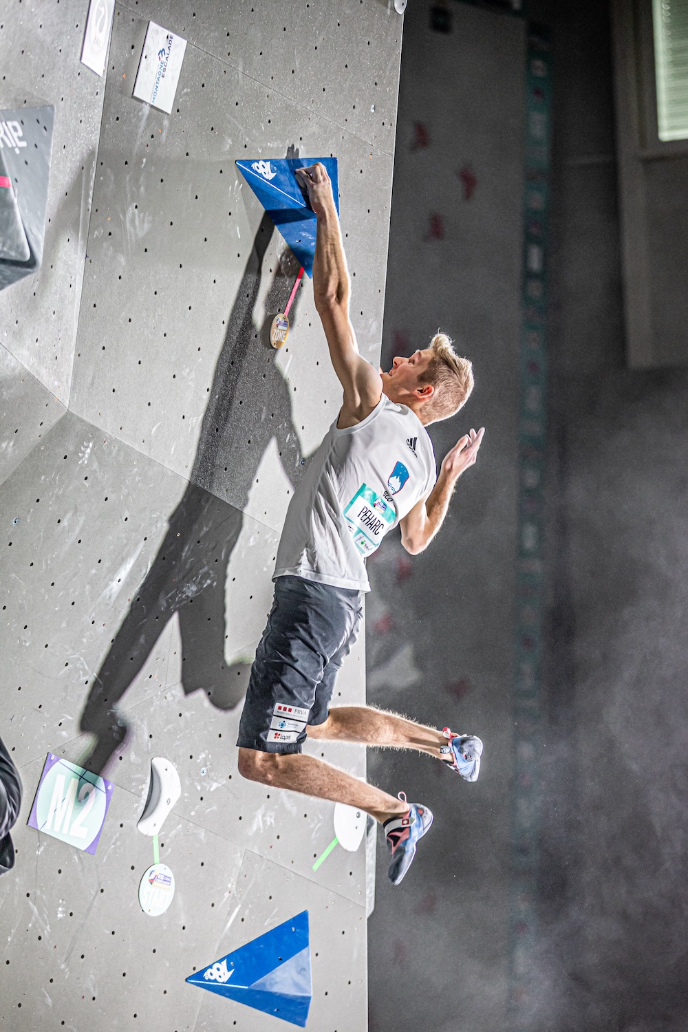 Anže competing in a bouldering event